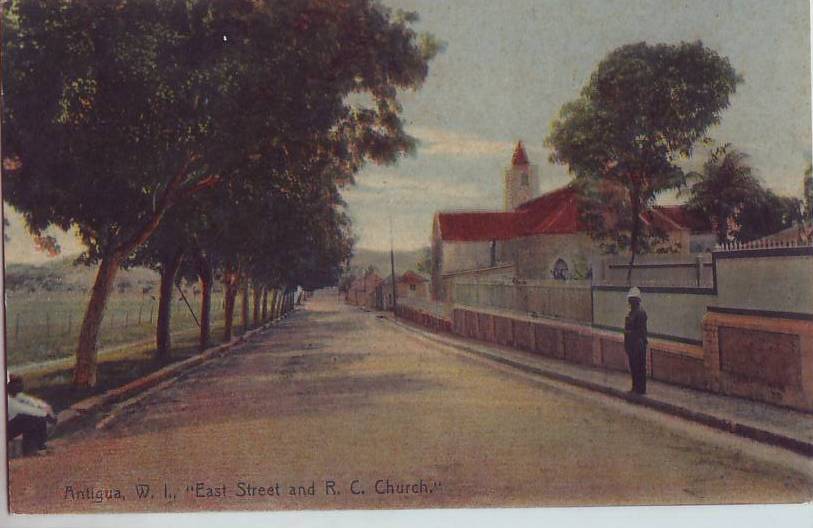 In this colourized postcard from 1964, note the row of Mahogany trees, with what is the Antigua Recreation Grounds on the right.